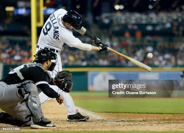 Nicholas Castellanos of the Detroit Tigers doubles to drive in Leonys Martin of the Detroit Tigers and tie the game at 4-4 as Omar Narvaez of the...