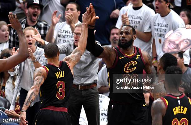 George Hill and LeBron James of the Cleveland Cavaliers react after a play in the second half against the Boston Celtics during Game Six of the 2018...