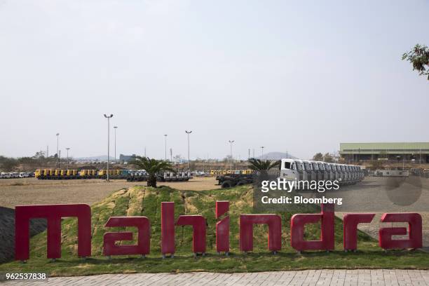 Signage stand at the Mahindra & Mahindra Ltd. Facility in Chakan, Maharashtra, India, on Tuesday, April 3, 2018. Mahindra & Mahindra is Indias...