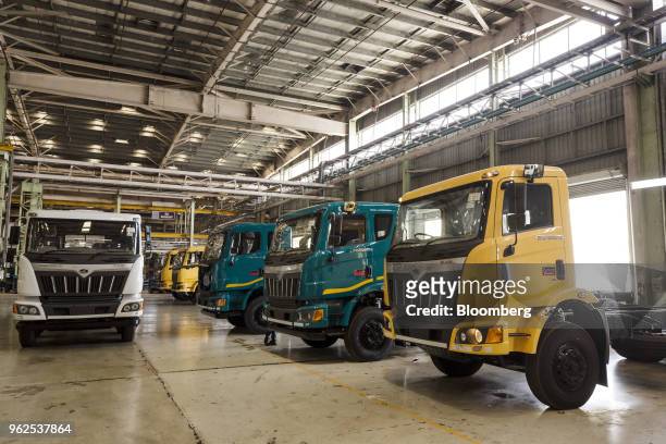 Trucks sit parked in the heavy vehicle assembly line of the Mahindra & Mahindra Ltd. Facility in Chakan, Maharashtra, India, on Monday, April 2,...