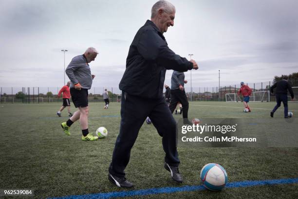 Participants taking part in a session of walking football at Anfield Sports and Community Centre in Liverpool. The initiative for men over the age of...