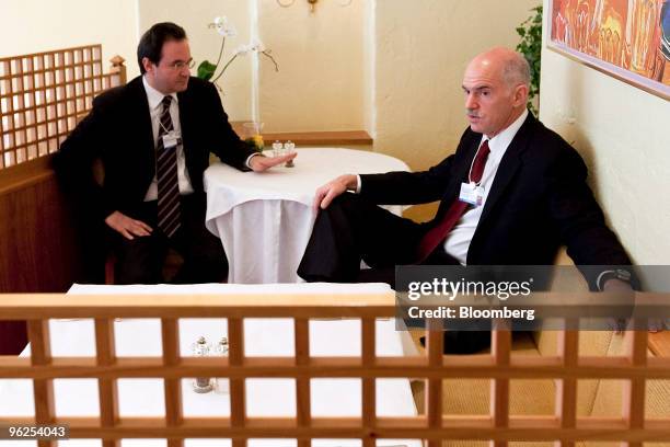 George Papandreou, prime minister of Greece, right, has a private meeting with George Papaconstantinou, Greek finance minister, on day three of the...