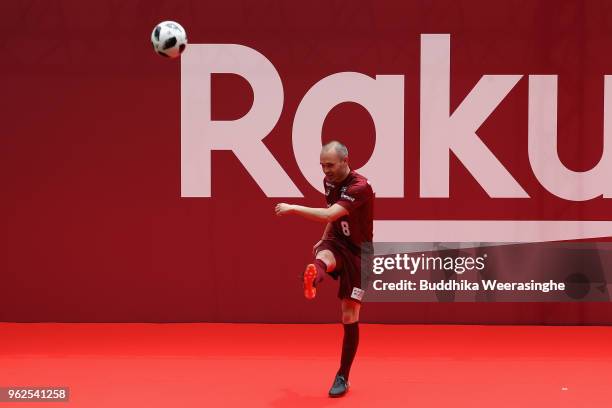 Vissel Kobe new player Andres Iniesta kicks the ball toward fans during the fan meeting at Noevir Stadium Kobe on May 26, 2018 in Kobe, Hyogo, Japan.