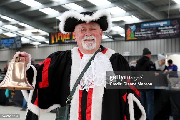 The town crier rings the bell for the festival goers to enter during the Bluff Oyster & Food Festival on May 26, 2018 in Bluff, New Zealand. The...