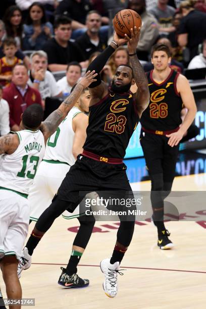 LeBron James of the Cleveland Cavaliers shoots in the second half against Marcus Morris of the Boston Celtics during Game Six of the 2018 NBA Eastern...