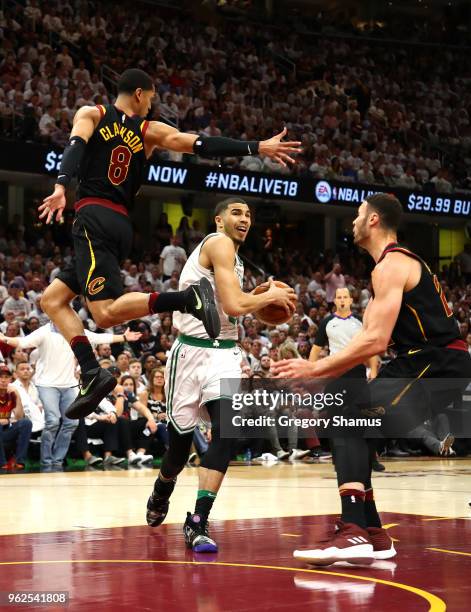 Kevin Love of the Cleveland Cavaliers drives to the basket against Jordan Clarkson and Larry Nance Jr. Of the Cleveland Cavaliers in the fourth...