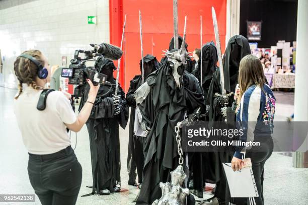 Cosplayers in character as Nazgul from Tolkien's The Lord of the Rings seen being interviewed by Channel 4 on Day 1 of the MCM London Comic Con at...