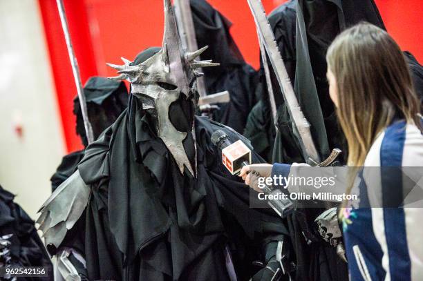 Cosplayers in character as Nazgul from Tolkien's The Lord of the Rings seen being interviewed by Channel 4 on Day 1 of the MCM London Comic Con at...