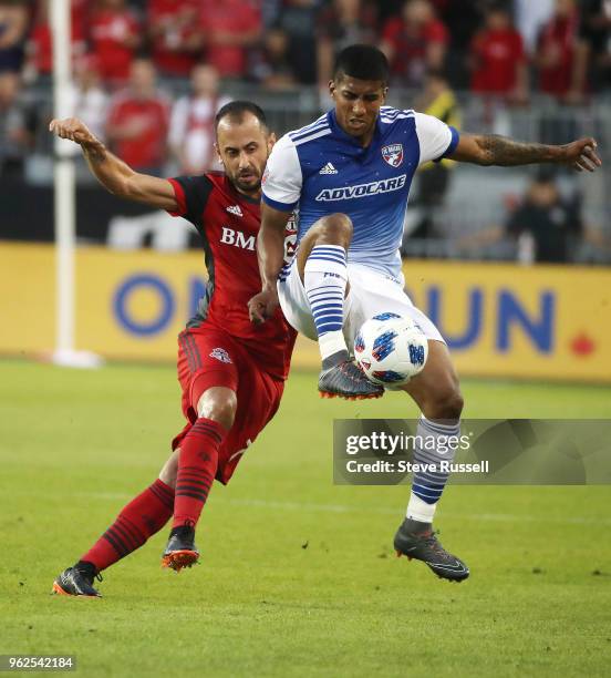 Toronto FC midfielder Victor Vazquez and FC Dallas midfielder Santiago Mosquera race for a ball as Toronto FC falls FC Dallas 1-0 at BMO Field in...