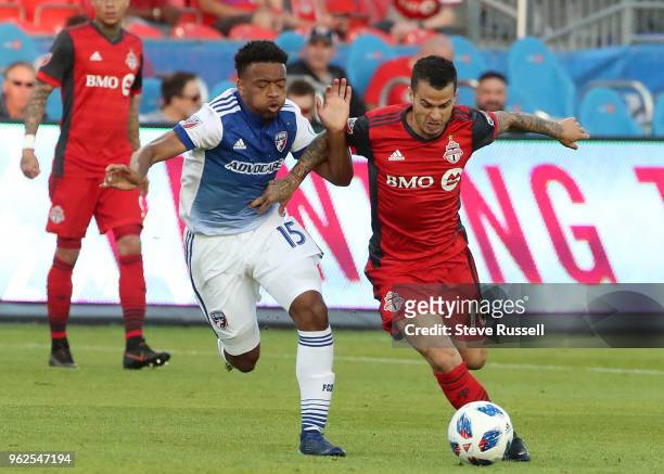 Dallas midfielder Jacori Hayes and Toronto FC forward Sebastian Giovinco race for a ball as Toronto FC falls FC Dallas 1-0 at BMO Field in Toronto....