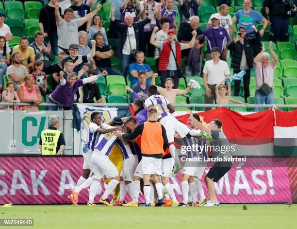 Unidentified teammates of Ujpest FC celebrate goalkeeper Filip Pajovic of Ujpest FC after he saved the last penalty during the Hungarian Cup Final...