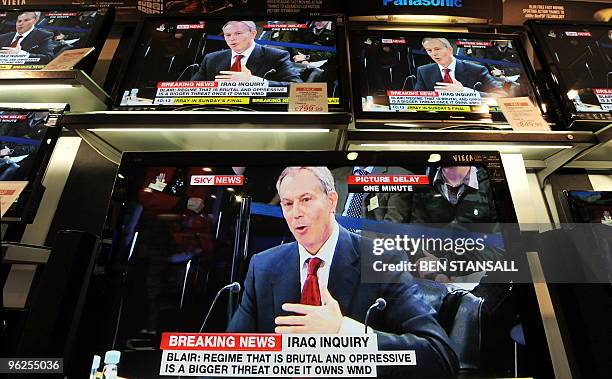 Televisions showing former British Prime Minister Tony Blair giving evidence to the Iraq War Inquiry are pictured in a shop in London, on January 29,...