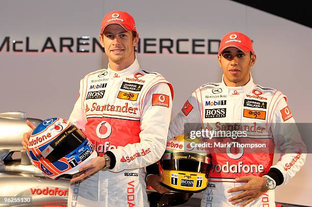 Jenson Button and Lewis Hamilton of Great Britain and team Vodafone McLaren Mercedes at the unveiling of the new car for the 2010 Formula 1 season at...