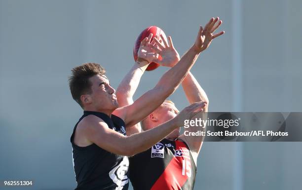 Fraser Pearce of the Blues and Josh Green of Essendon compete for the ball during the round eight VFL match between the Northern Blues and Essendon...