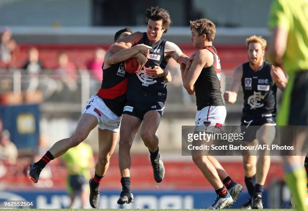 Jack Silvagni of the Blues is tackled during the round eight VFL match between the Northern Blues and Essendon at Ikon Park on May 26, 2018 in...