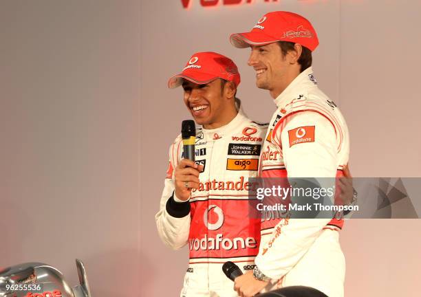 Jenson Button and Lewis Hamilton of Great Britain and team Vodafone McLaren Mercedes at the unveiling of the new car for the 2010 Formula 1 season at...