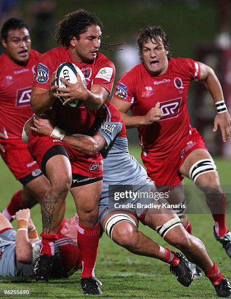 Saia Faingaa of the Reds looks to pass during a Super 14 trial match between the Reds and the Crusaders at Suncorp Stadium on January 29, 2010 in...