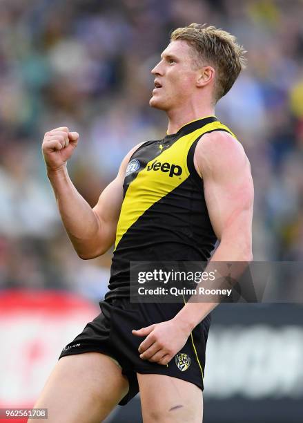 Josh Caddy of the Tigers celebrates kicking a goal during the round 10 AFL match between the Richmond Tigers and the St Kilda Saints at Melbourne...