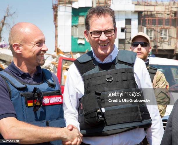 April 24: German Development Minister Gerd Mueller, CSU, in conversation with Pehr Lodhammar, head of UNMAS mission in Iraq. Booby trap removal at Al...