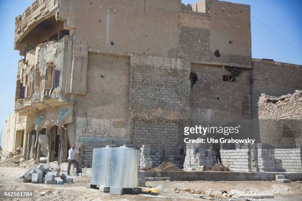 April 24: Workers in masonry work for the reconstruction of ruined houses in the old town in Mosul on April 24, 2018 in MOSUL, IRAQ.