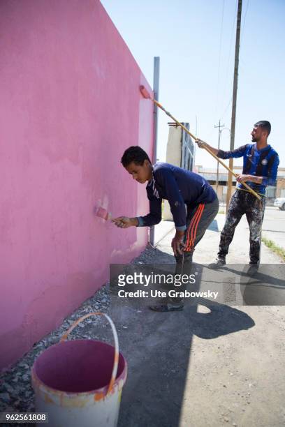 April 24: Cash for work. Painters paint a wall at a school rehabilitated with BMZ funds in West Mosul on April 24, 2018 in MOSUL, IRAQ.