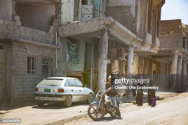 April 24: People on a street in the destroyed old town in Mosul on April 24, 2018 in MOSUL, IRAQ.