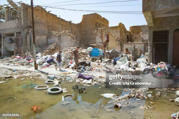 April 24: Children walk through debris in the destroyed old town in Mosul on April 24, 2018 in MOSUL, IRAQ.