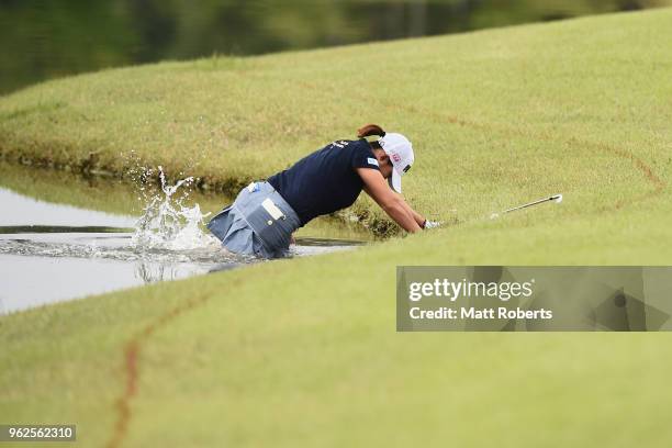 Erina Hara of Japan falls into the water on the 10th hole during the second round of the Resorttust Ladies at Kansai Golf Club on May 26, 2018 in...