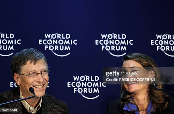 Microsoft founder Bill Gates and his wife Melinda smile during a press conference on their "Bill & Melinda Gates Foundation" on the third day of the...