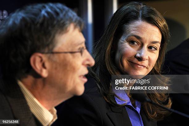 Microsoft founder Bill Gates and his wife Melinda smile during a press conference on their "Bill & Melinda Gates Foundation" on the third day of the...