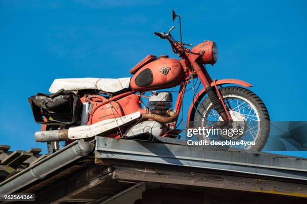 an old red motorcycle on the roof - 4 wheel motorbike stock pictures, royalty-free photos & images