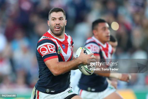 James Tedesco of the Roosters runs the ball during the round 12 NRL match between the Sydney Roosters and the Gold Coast Titans at Central Coast...