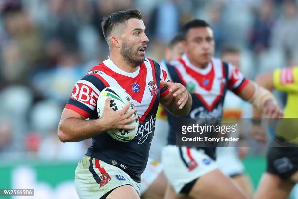 James Tedesco of the Roosters runs the ball during the round 12 NRL match between the Sydney Roosters and the Gold Coast Titans at Central Coast...