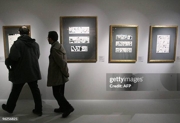 Visitors look at cartoons at the Musee de la Bande dessinée, on January 29, in Angouleme, western Frduring the 37th edition of the International...