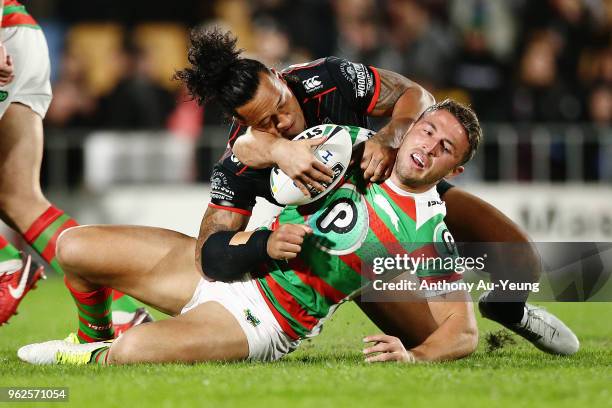 Sam Burgess of the Rabbitohs is tackled by James Gavet of the Warriors during the round 12 NRL match between the New Zealand Warriors and the South...