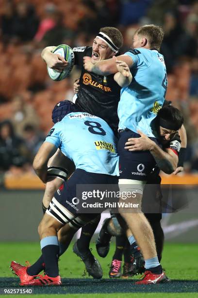 Brodie Retallick of the Chiefs is tackled during the round 15 Super Rugby match between the Chiefs and the Waratahs at FMG Stadium on May 26, 2018 in...