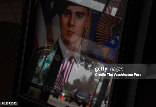Portrait of Army Spc. Gabriel D. Conde sits on a table during a memorial service at LifeBridge church on May 12, 2018 in Longmont, Co. Army Spc....