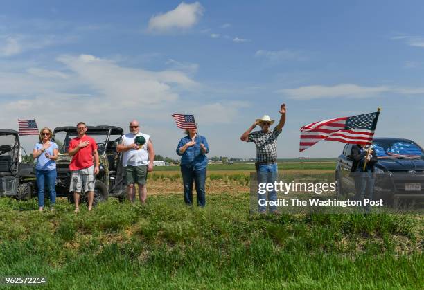 The remains of Army Spc. Gabriel D. Conde of Berthoud, Co., make their way from Northern Colorado Regional Airport to Howe Mortuary as folks wave...