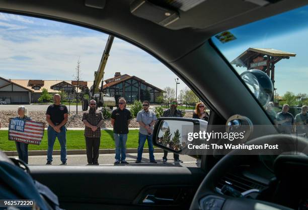 The remains of Army Spc. Gabriel D. Conde of Berthoud, Co., make their way from Northern Colorado Regional Airport to Howe Mortuary as folks wave...