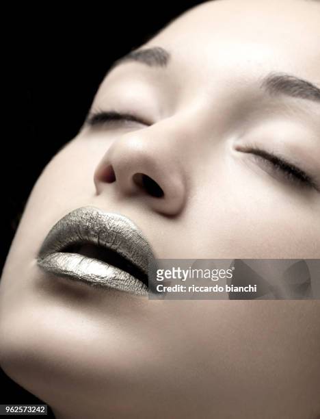 portrait of woman with closed eyes and silver mouth - silver lipstick stock pictures, royalty-free photos & images