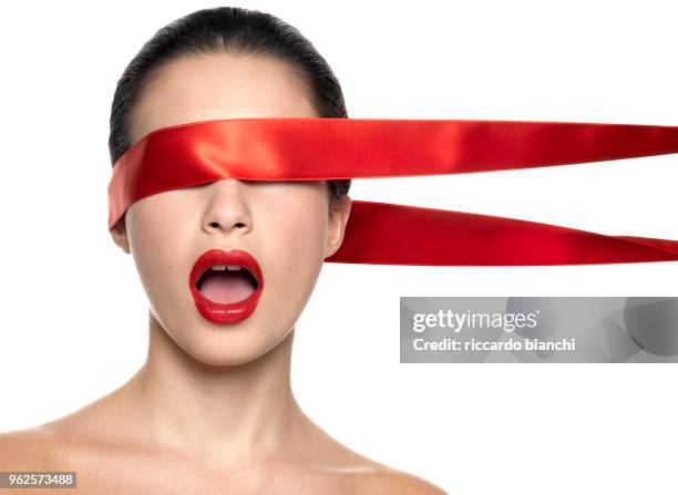 naked woman with red lips and red ribbon on her eyes - ribbon in mouth stock pictures, royalty-free photos & images