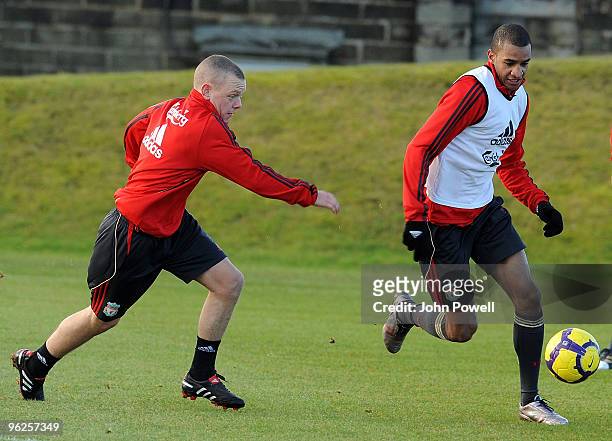 David Ngog with Jay Spearing during a training session at Melwood Training Ground> on January 29, 2010 in Liverpool, England.