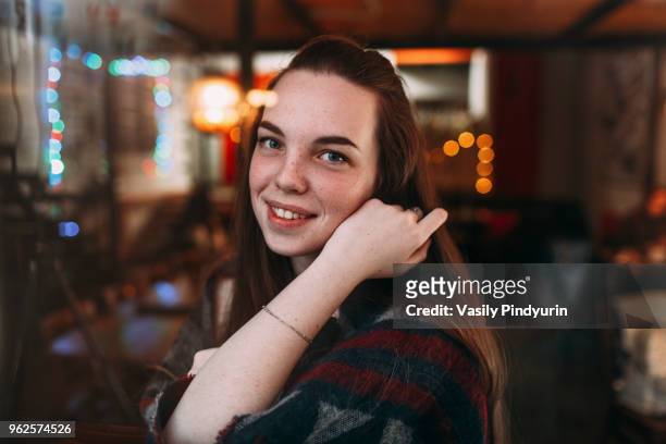 portrait of smiling beautiful young woman at cafe - pindyurin stock-fotos und bilder