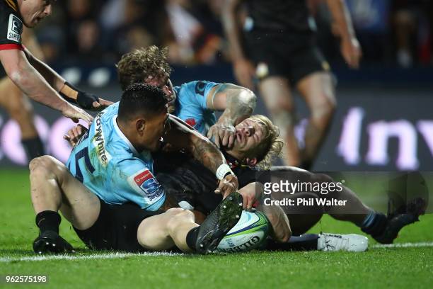 Damian McKenzie of the Chiefs scores a try during the round 15 Super Rugby match between the Chiefs and the Waratahs at FMG Stadium on May 26, 2018...
