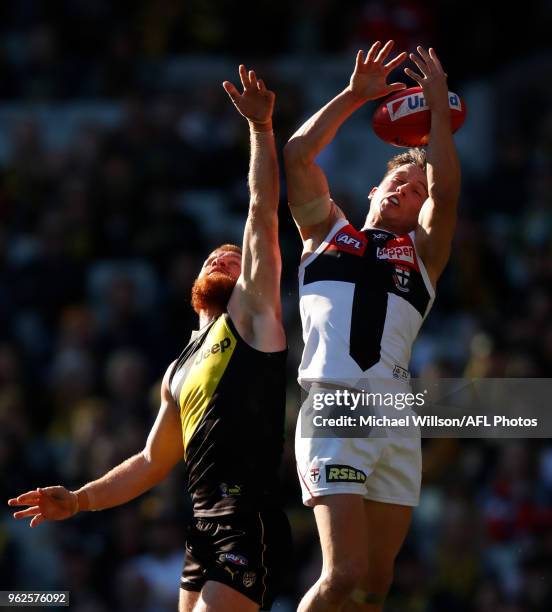 Jack Billings of the Saints and Nick Vlastuin of the Tigers compete for the ball during the 2018 AFL round 10 match between the Richmond Tigers and...