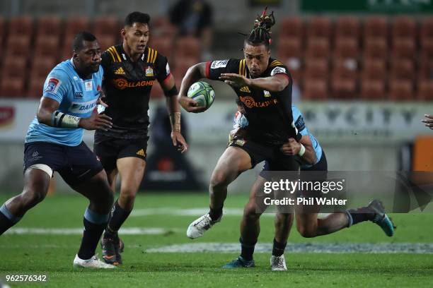 Sean Wainui of the Chiefs is tackled during the round 15 Super Rugby match between the Chiefs and the Waratahs at FMG Stadium on May 26, 2018 in...