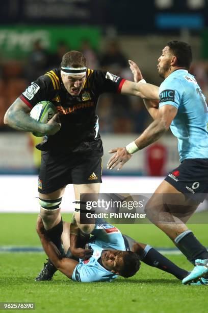 Brodie Retallick of the Chiefs is tackled during the round 15 Super Rugby match between the Chiefs and the Waratahs at FMG Stadium on May 26, 2018 in...