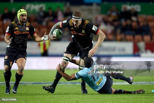 Brodie Retallick of the Chiefs is tackled during the round 15 Super Rugby match between the Chiefs and the Waratahs at FMG Stadium on May 26, 2018 in...