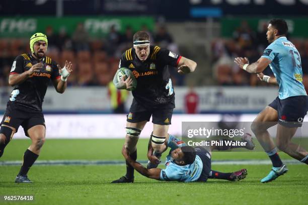 Brodie Retallick of the Chiefs is tackled during the round 15 Super Rugby match between the Chiefs and the Waratahs at FMG Stadium on May 26, 2018 in...