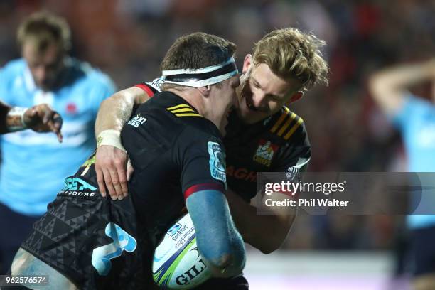 Brodie Retallick of the Chiefs is congratulated on his try by Damian McKenzie during the round 15 Super Rugby match between the Chiefs and the...